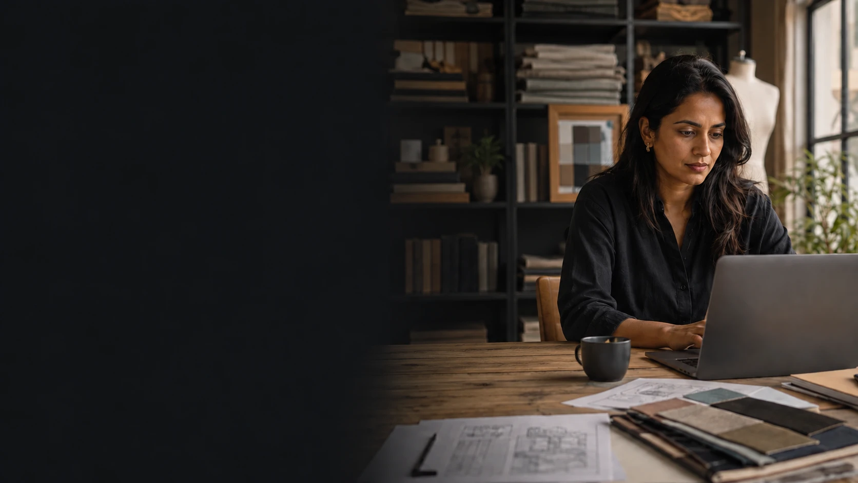 Illustrative photograph of a business owner working at her laptop.
