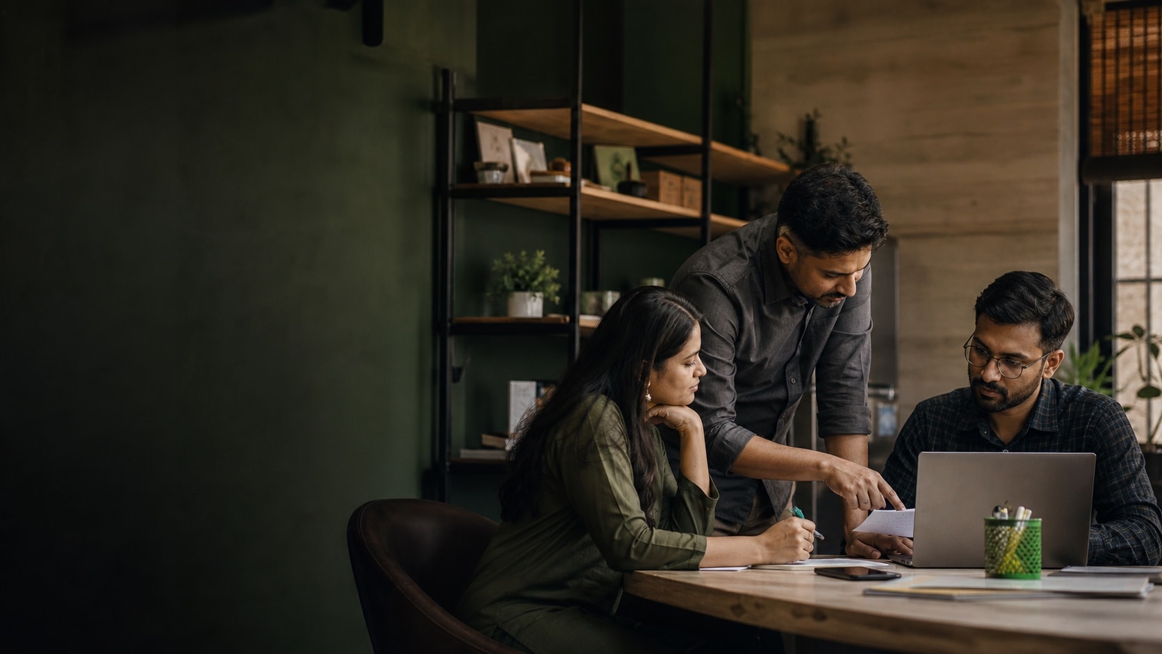 A small business team working through a customer handoff together.